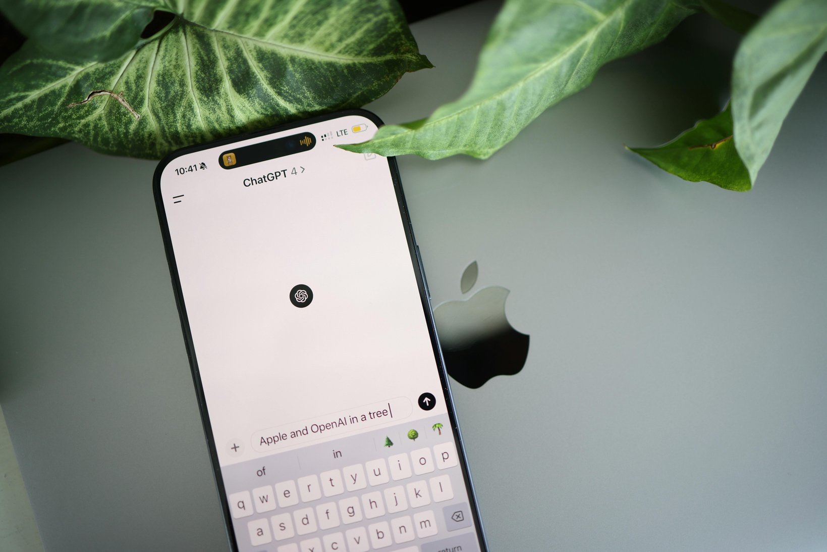 A close up of an iphone with a keyboard on it